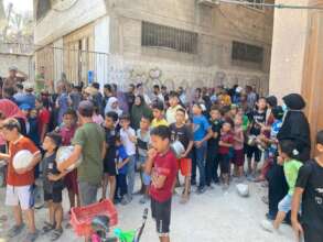 Children arrive early to receive meals