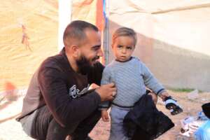 Kayed with his son