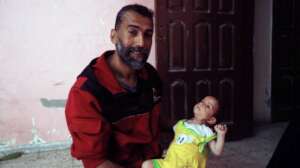 Little baby Taher with his father