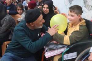 ABCD, our CBO partner, giving clothes to children