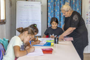 Kristina helping children with their homework.