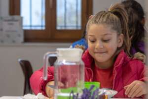 Ledjana, 7, at lunch