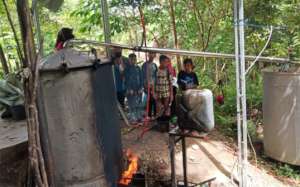 Observing the distillation process.