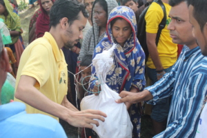 Volunteers Distributing Aid to Flood Victims