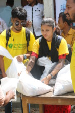 Volunteers Distributing Aid to Flood Victims