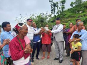 Benificiaries getting fruit sapling