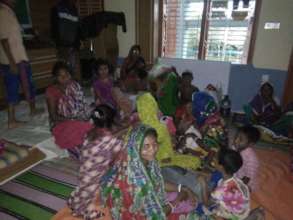 Women are in the BEDS Cyclone shelter center