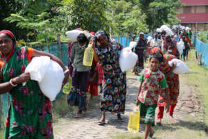 Villagers returning with relief