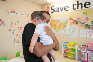 Baby and his father in a child friendly space