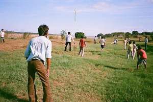 Boys playing Cricket in their games section