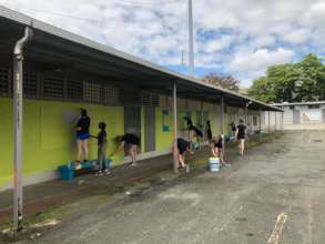 Volunteers painting the Santiago School