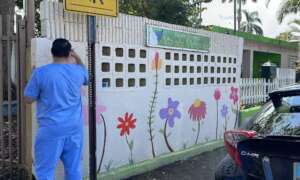 Volunteer helping paint