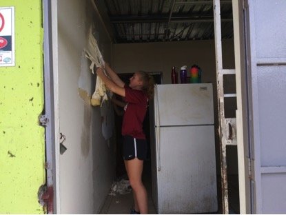 Volunteer preparing the Community Kitchen area