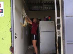Volunteer preparing the Community Kitchen area