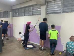Volunteers painting the Santiago School