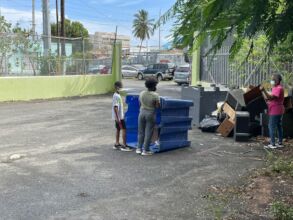 Young resident helping to clean the center