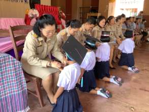 All teacher give a blessing to the children