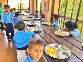 Fig 3: Some students having lunch in new trays