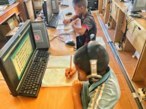 Figure 4: Kids taking notes
