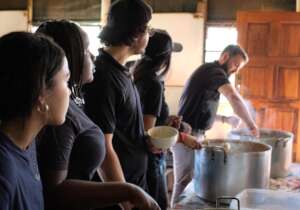 Dishing up food at community kitchen