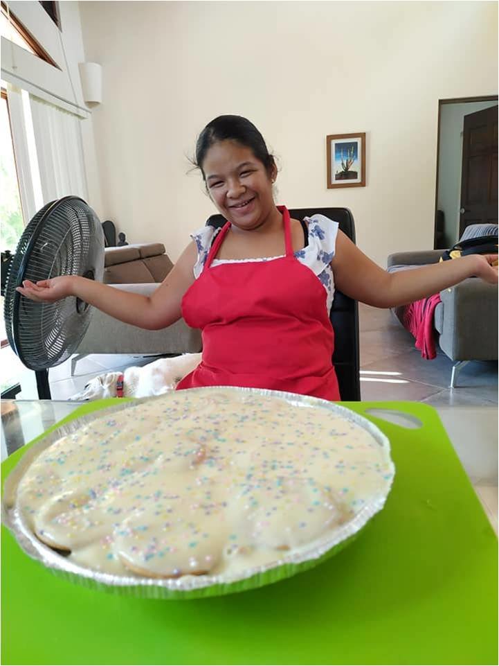 Irma is very proud of her cooking creation!