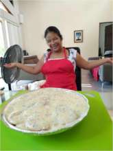 Irma is very proud of her cooking creation!