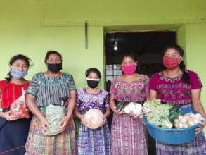Family receiving food from the organic garden