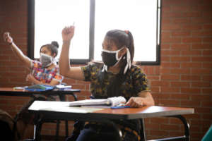 Girl Pioneers actively engaging in a class