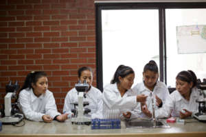 Girl Pioneers in Science Class Photo by Anna Watts