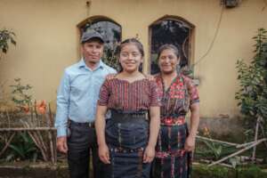 Angela with her proud parents