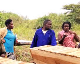 Executive Director Trains bee farmers on site.