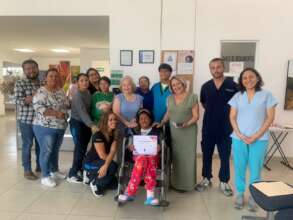 Esther receiving a recognition