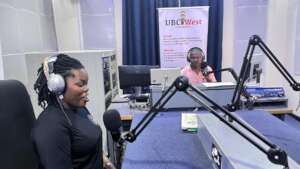 Brendah and cohost converse during a radio show.