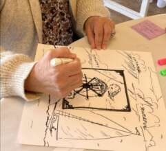 Educator creates art during a retreat in Oakland