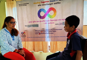 A teacher practices peer support with a student