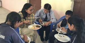 Urmila (top left) with students during a workshop