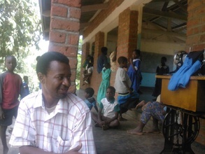 Joseph P. at a tailoring facility in Malawi