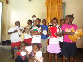 Children with gifts received from donors in the U.