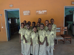 children in front of their classroom