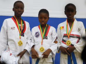 Diakassan, Kadiatou and Astan with their Gold Meda