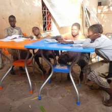Children enjoying their new desks