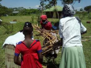 Women loading corn stalks at training session