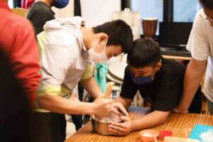 Kids making dessert portion ; strawberry mochi