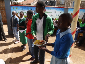 Families receive hot lunch during distribution