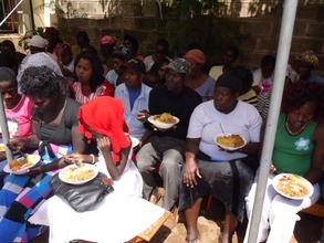 Families receive hot lunch during distribution