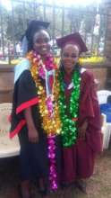 Alice celebrating graduation with a classmate