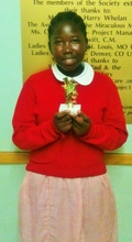Grace shows off her trophy