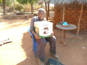 Mr. Hara happy receiving the clean cookstove