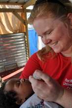 Deworming a baby as part of health education