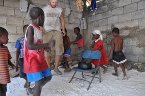 International volunteers and kids playing